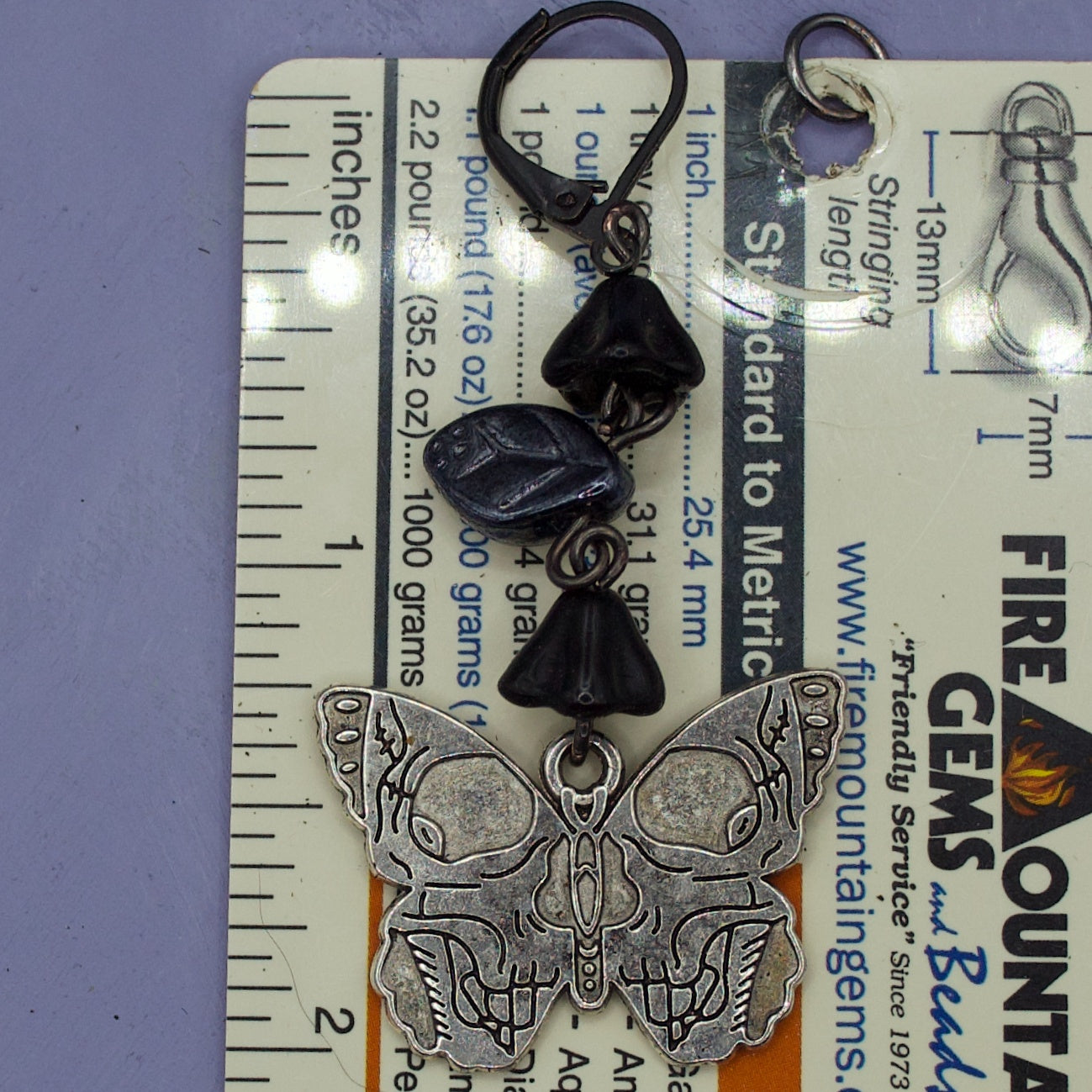Butterfly skull flower earrings